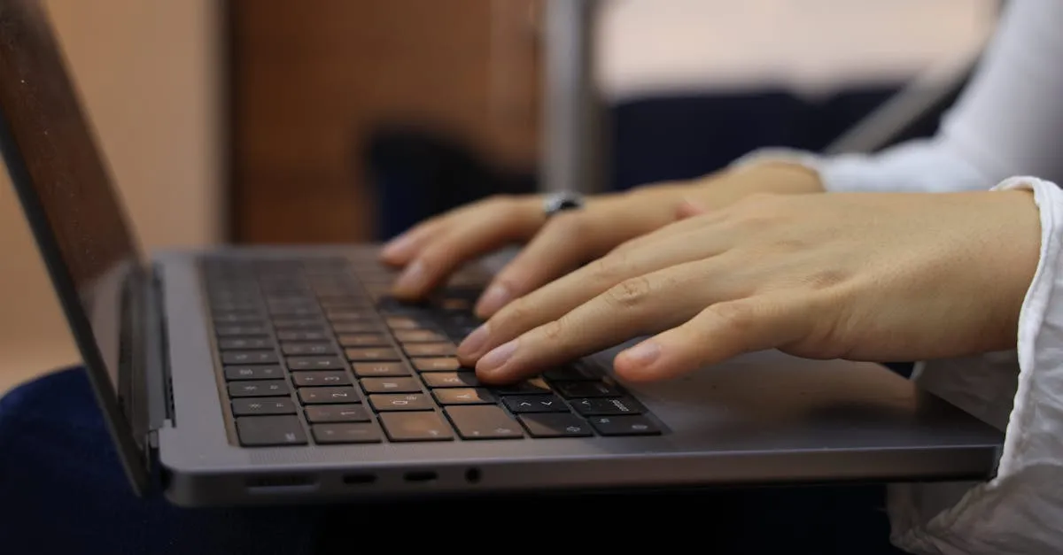 Hands typing on a laptop keyboard — word counting for writers and students